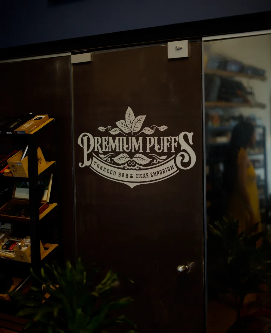 The Premium Puffs entrance and branded storefront in Chania